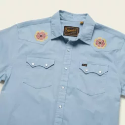Howler Brothers Crosscut Deluxe Shortsleeve Sale -Simms || Orvis || Patagonia Sales 2023 S23 SS Shirts Crosscut Deluxe SS Beach Blooms Blue Chambray Angle
