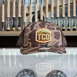 TCO Fly Shop Hat Crest Logo - Printed 5 Panel Trucker Admiral Duck Camo - Black -Simms || Orvis || Patagonia Sales 2023 image 2f22518f 2fa1 4315 84b4 2e8349a2ace2